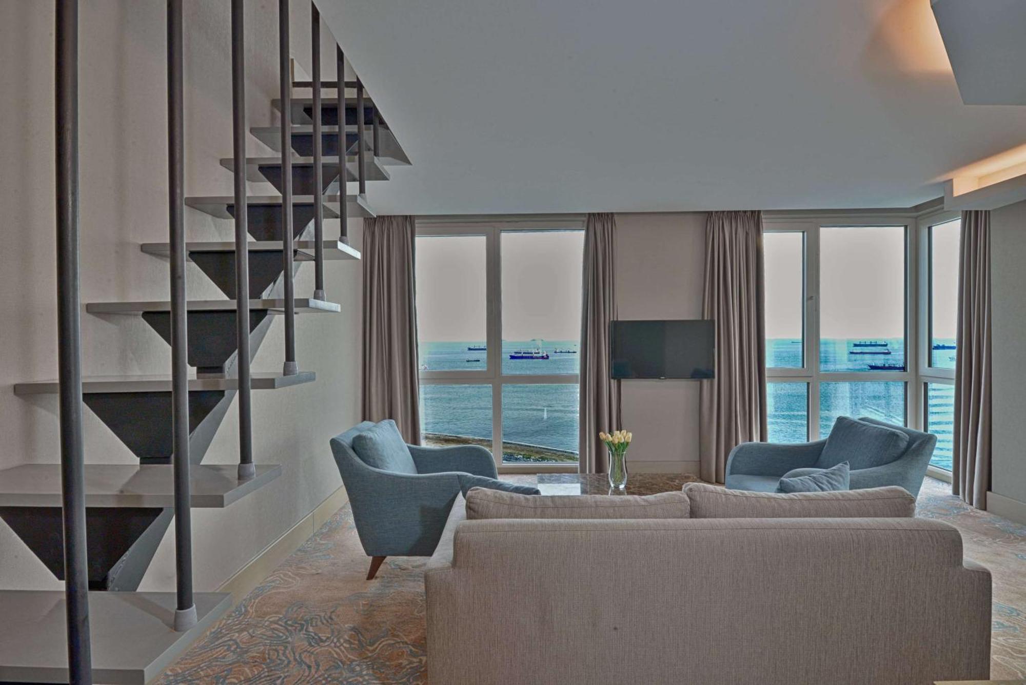 Duplex Suite with One Queen Bed and Two Single Beds with Balcony and View