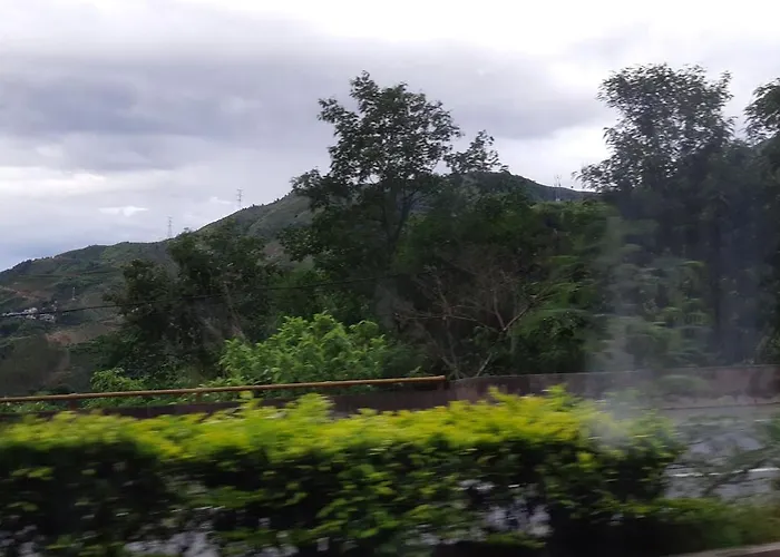 Xishuangbanna International Aerial Garden South Of Mekong River Business Hotel 傣江南商务酒店
